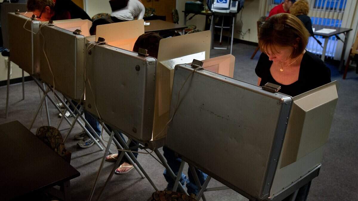 Voters including Debora Smith (cq), right, cast their ballots at the polling place at El Dorado County Senior Center in El Dorado Hills on Tuesday, November 6, 2012.