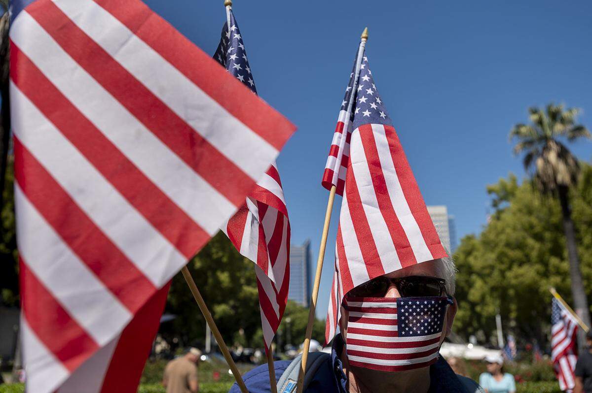 Protesters demonstrate at the Capitol in Sacramento on Friday, May 1, 2020, against Gov. Gavin Newsoms stay-at-home order to slow the spread of the coronavirus.