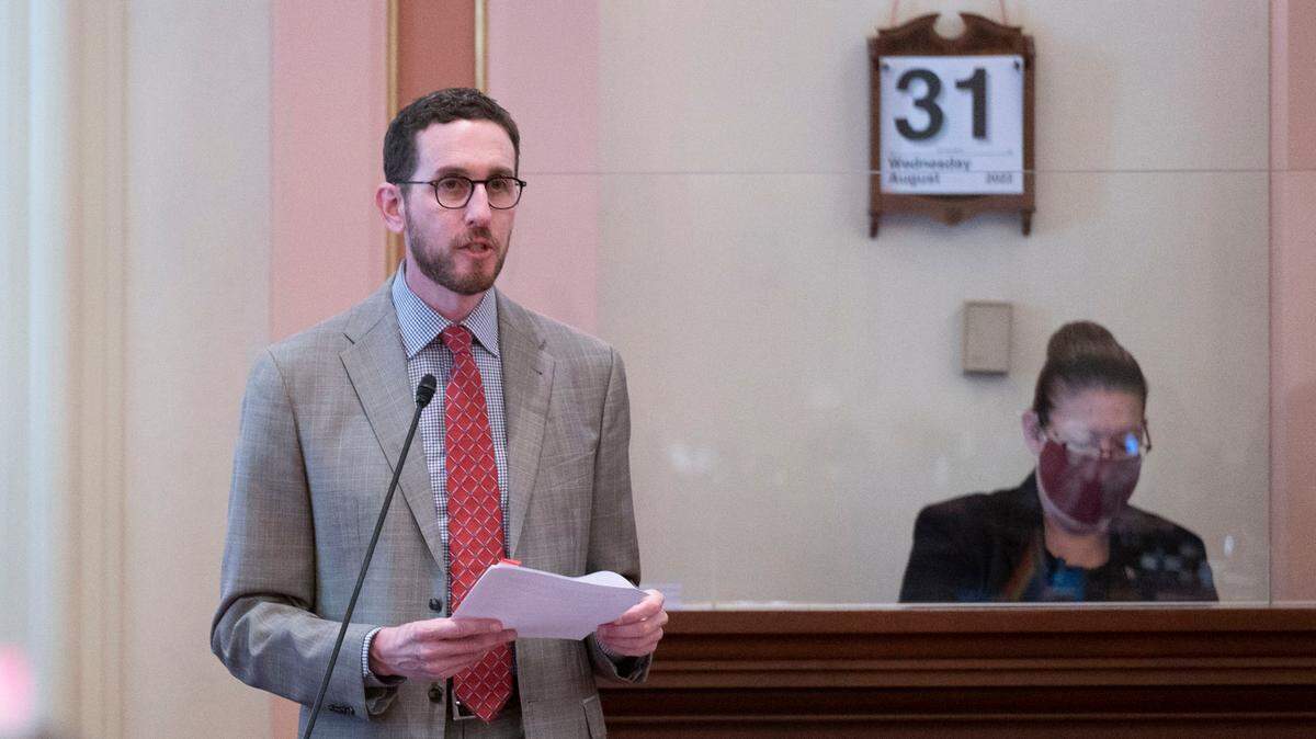 State Sen. Scott Wiener, D-San Francisco, talks to members of the Senate during the last day of the legislative session on Wednesday. The Senate passed Wiener’s SB 107, which would turn the state into a refuge for transgender children seeking gender-affirming care.