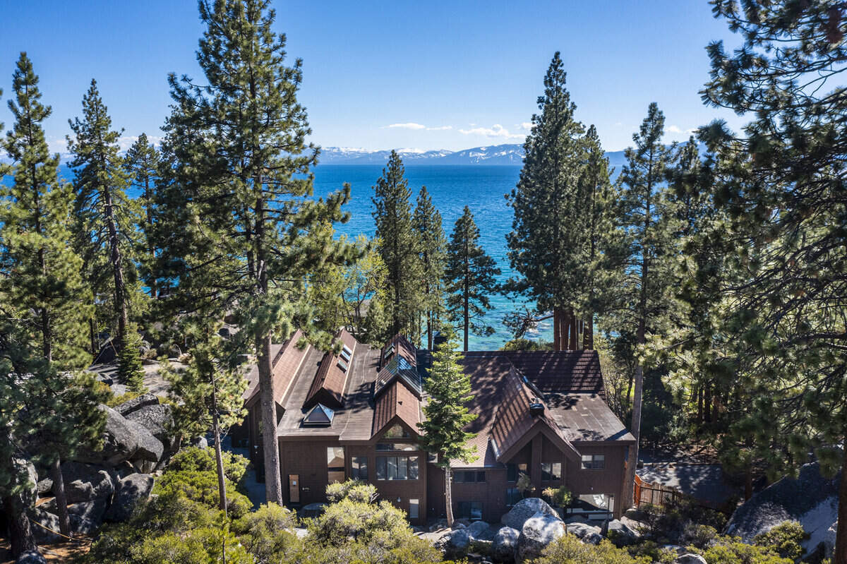 This 9,800-square-foot estate sits proudly on a private, one-acre lot overlooking Lake Tahoe’s turquoise waters.