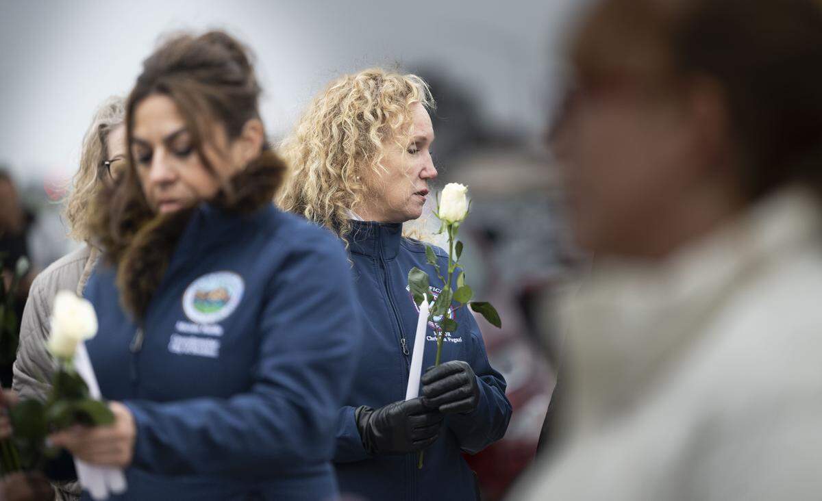 Stockton Mayor Christina Fugazi holds a white rose during a vigil on Nov. 30 after a mass shooting near Stockton.