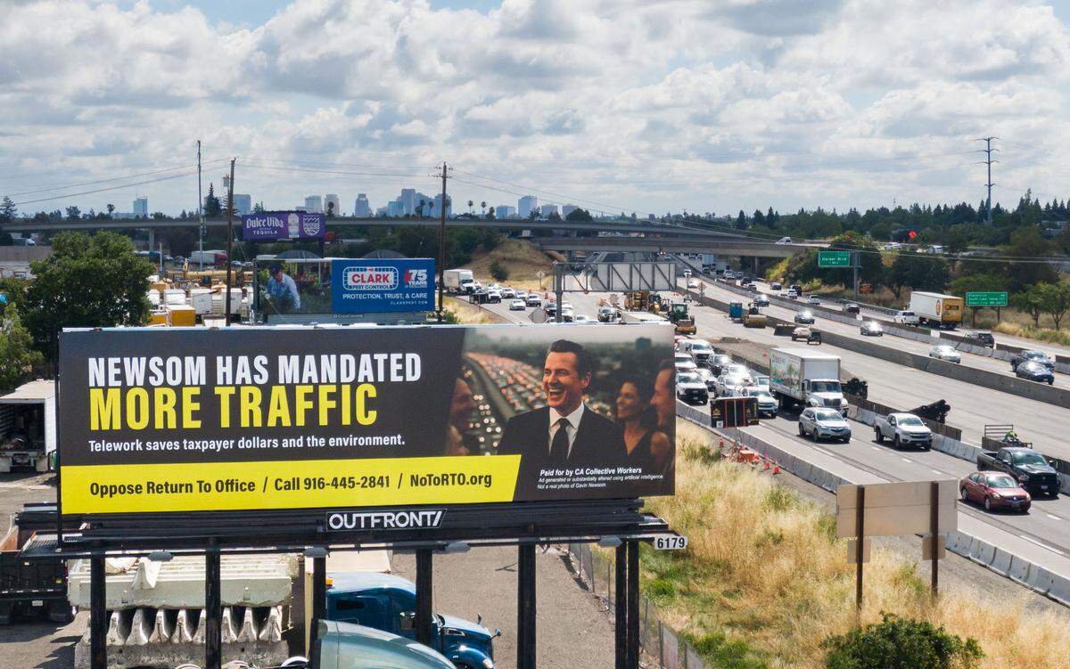 A billboard, designed and paid for by California state workers, criticizing the potential traffic impact of Gov. Gavin Newsom’s return to office order stands on the north side of the Highway 50-Interstate 80 interchange in West Sacramento on Tuesday. It is visible to eastbound drivers as they approach the capital.
