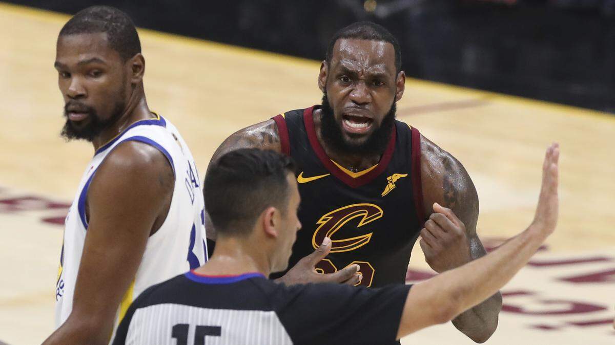 Cleveland Cavaliers forward LeBron James argues a call with referee Zach Zarba during Game 3 of the NBA Finals on Wednesday. NBA refs were live on Twitter as the game went on.