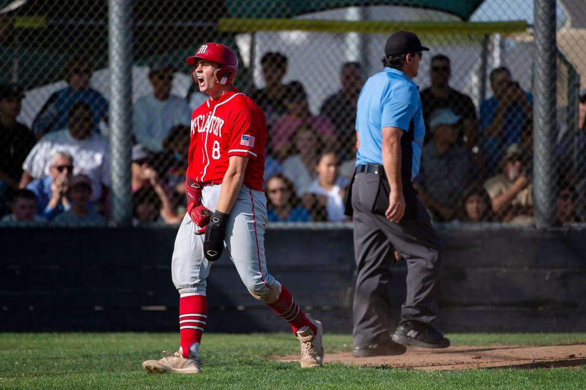McClatchy Lions catcher Malcolm Moore celebrates after scoring during a May 16 playoff game against top-seeded Franklin High School in Elk Grove.
