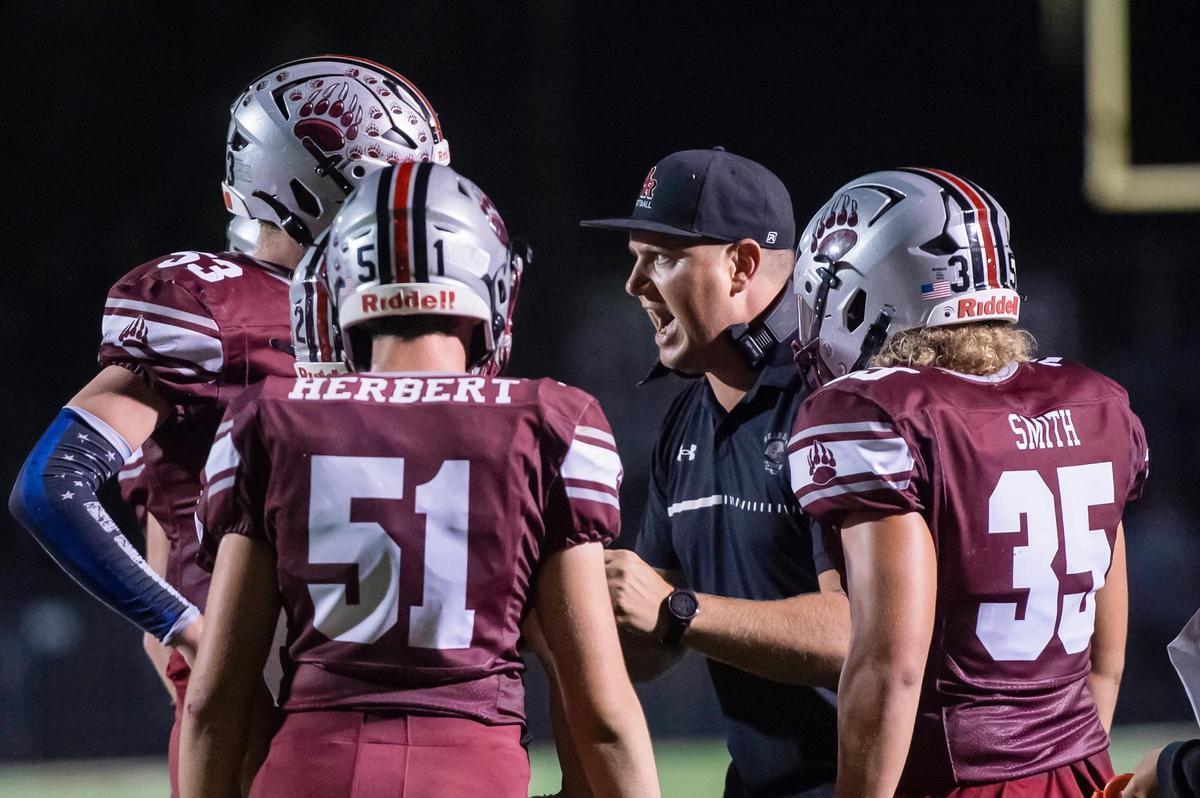 Bear River coach Tanner Mathias talks to the team during a timeout in the first half of the game against the Tamalpais Red Tailed Hawks on Thursday, Sept. 14, 2023, at Bear River High School in Lake of the Pines.
