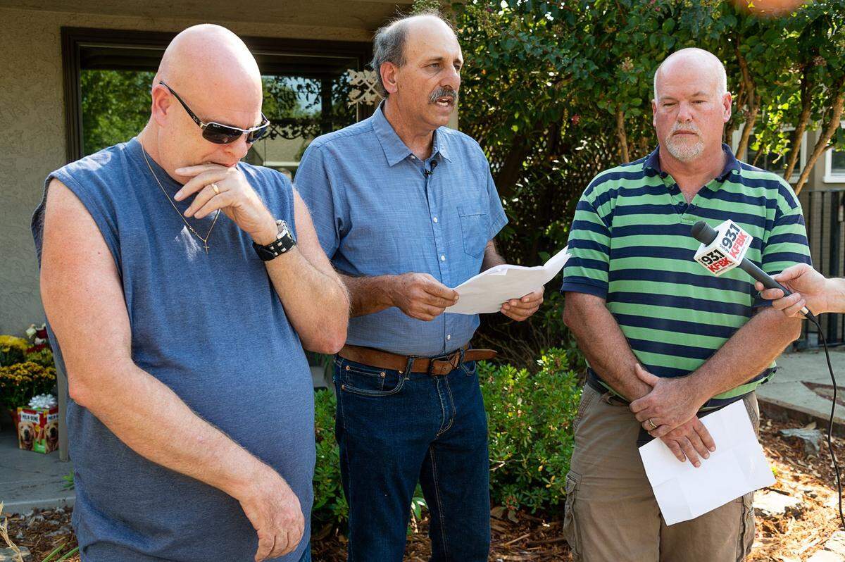 George Tibbitts reads a statement to the media with his brothers Casey and Dan on Wednesday, Sept. 8, 2021, in Sacramento about the murder of their sister Mary Tibbitts who was killed last week in her home in Land Park. Troy Davis, a 51-year-old transient and parolee, has been charged with her murder.