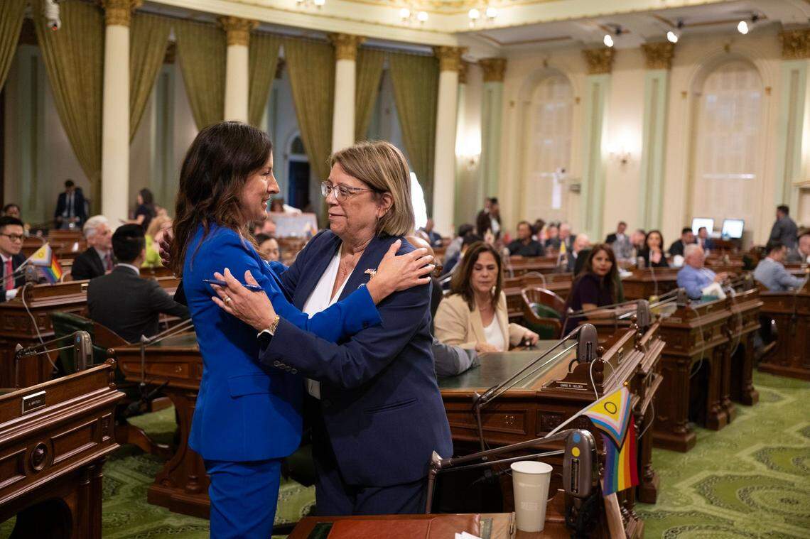 Assemblywoman Cottie Petrie-Norris, D-Irvine, left, the author of AB x2-9, is congratulated by Cecilia Aguiar-Curry, D-Winters, after the bill passed during a special session on Tuesday. The bill, which must still pass in the state Senate, directs regulators to study the impacts of increasing the amount of ethanol permitted in California’s fuel blends from the current 10% to 15%.