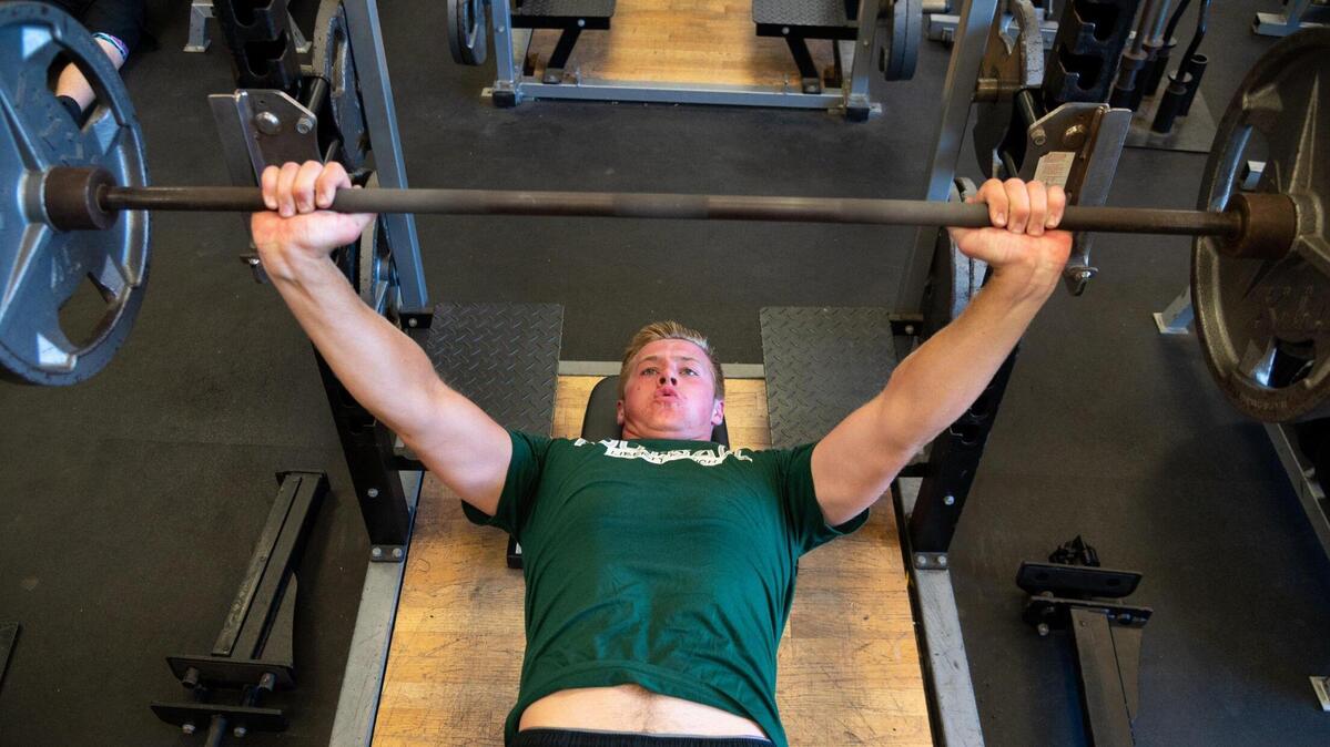 Liberty Ranch Hawk tight end Cody Smith workouts in the training room in Galt, Wednesday, July 20, 2022. At 6-foot-7, Cody Smith, who has had a couple of seasons cut short by injuries is looking to make a big impact on the local sports scene before going to college.