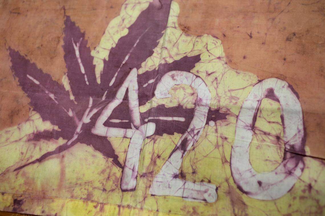 This Friday, April 13, 2018, photo, shows a Waldos 420 flag from 1972 made by a classmate at San Rafael High School, at a bank vault in San Francisco. Friday is April 20, or 4/20. That’s the numerical code for marijuana’s high holiday, a celebration and homage to pot’s enduring and universal slang for smoking. And five Northern California high school stoner buddies widely credited with creating the shorthand slang for getting high nearly 50 years ago now serve as the day's unofficial grand masters. (AP Photo/Eric Risberg)
