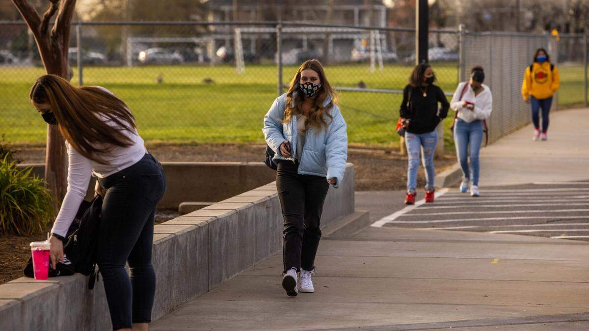High school students walk to class before the first bell at Cordova High School in Rancho Cordova on Wednesday, March 17, 2021.