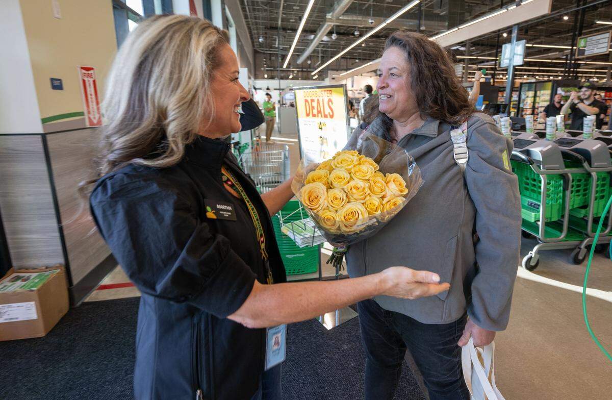 ‘I’ve been excited for this store to open for a long time,’ said Juliana Loconte, right, of Rocklin after she was the first in line at the Roseville grand opening of the first Amazon Fresh in Northern California on Thursday, Aug. 22, 2024.
