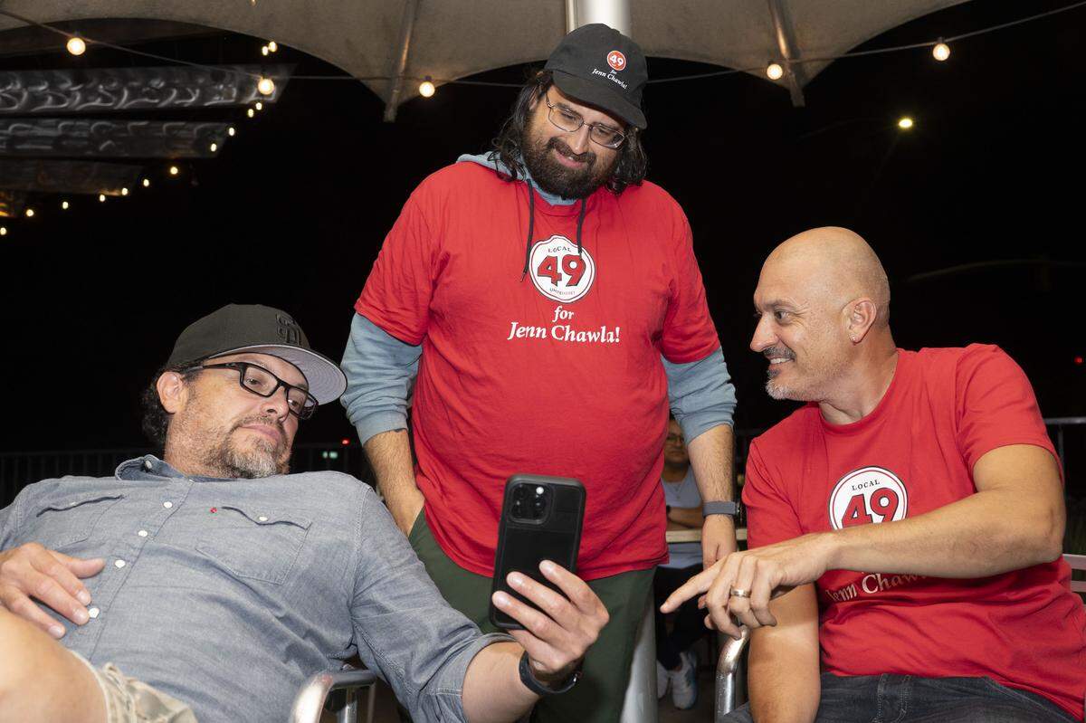 Supporters of Jenn Chawla check election results during her election night party at Frends Brewhouse in South Natomas on Tuesday.