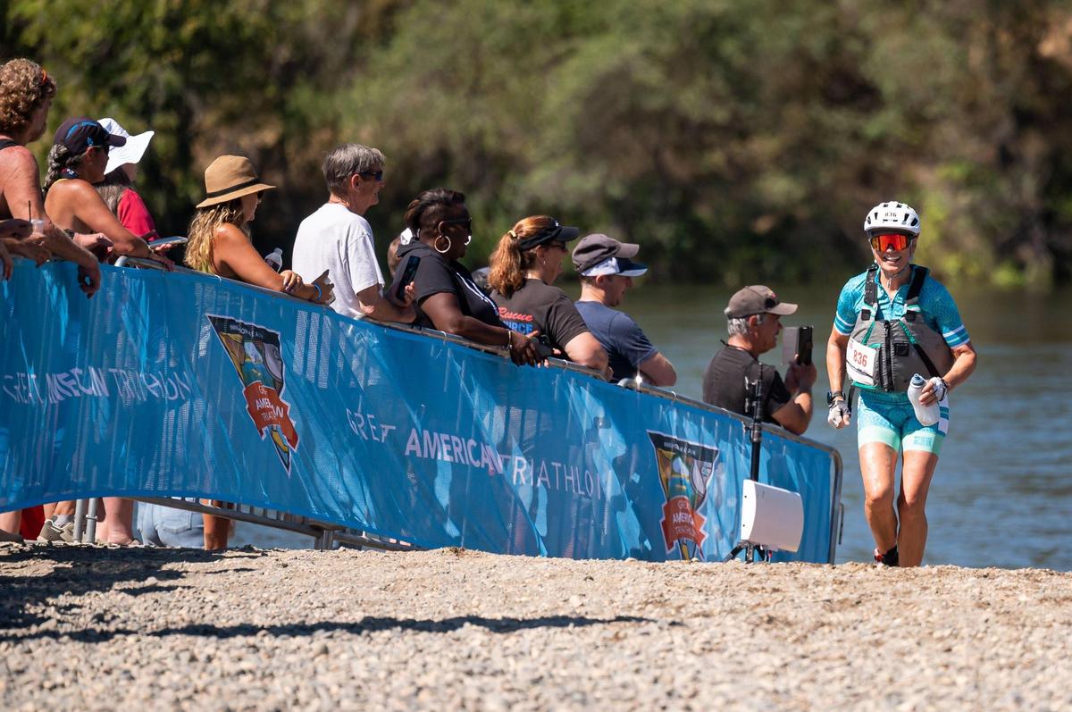 Ramona Blount, a Sacramento resident competing in the Ironwoman 60+ division, runs the last stretch to the finish line at the Great American Triathlon, previously known as Eppie’s Great Race, on Saturday at River Bend Park in Rancho Cordova.