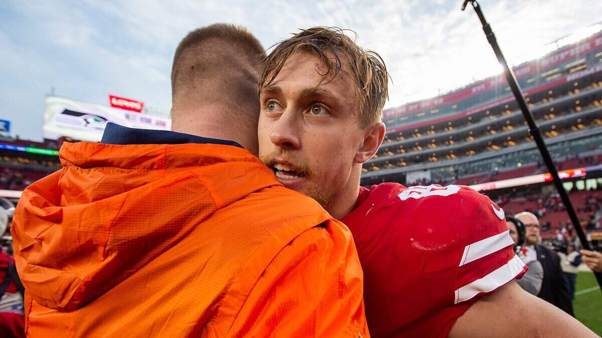 49ers tight end George Kittle, right, is congratulated by a Denver Broncos player after a 20-14 victory Sunday at Levi’s Stadium. Tickets to the 49ers’ upcoming home game against the Seattle Seahawks can be purchased cheap.
