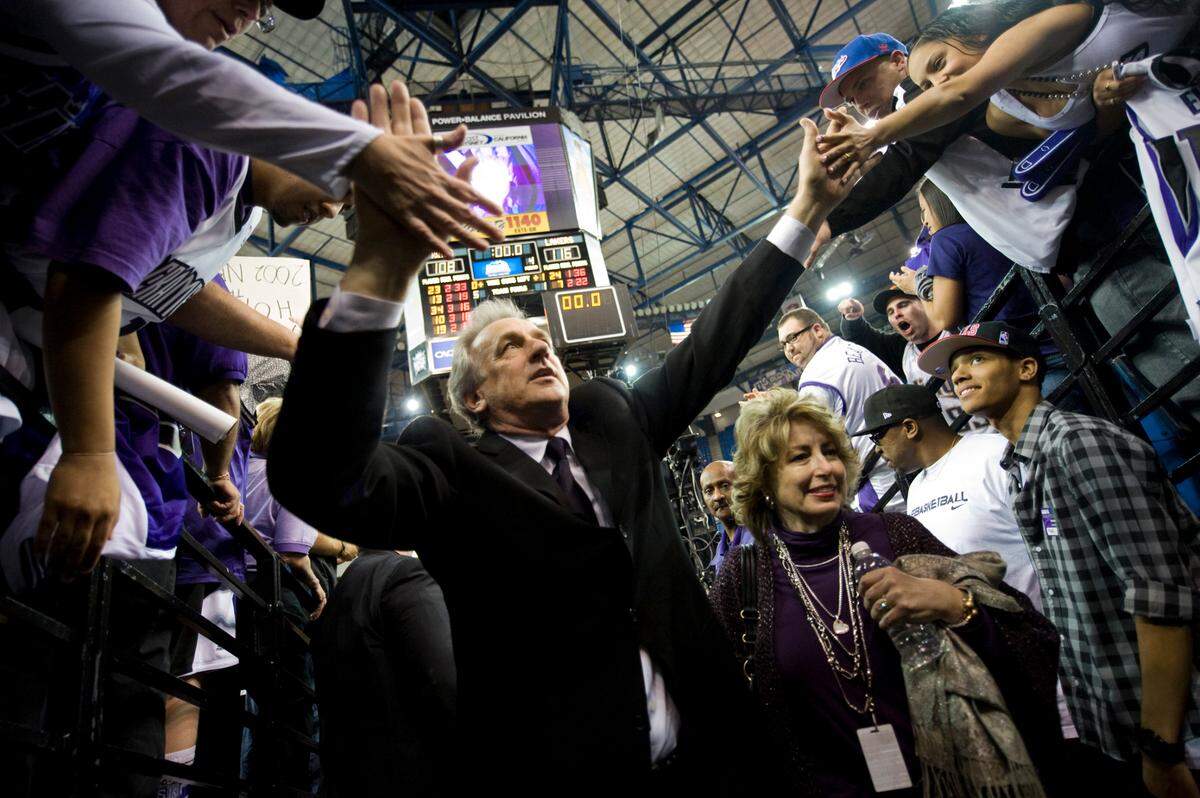 Head coach Paul Westphal high-fives fans after the seaon’s last game on April 13, 2011, at Power Balance Pavilion in Sacramento. Wesphal was joined by his wife, Cindy, right.