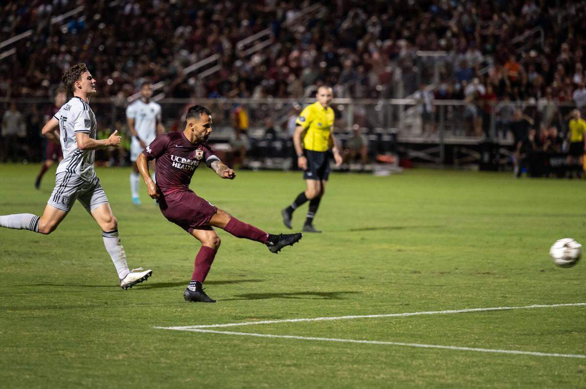 Sacramento Republic midfielder Rodrigo Lopez kicks in the teams second goal after surging past San Jose Earthquakes defender Tanner Beason in a 2-0 U.S. Open Cup win on Wednesday, May 25, 2022.