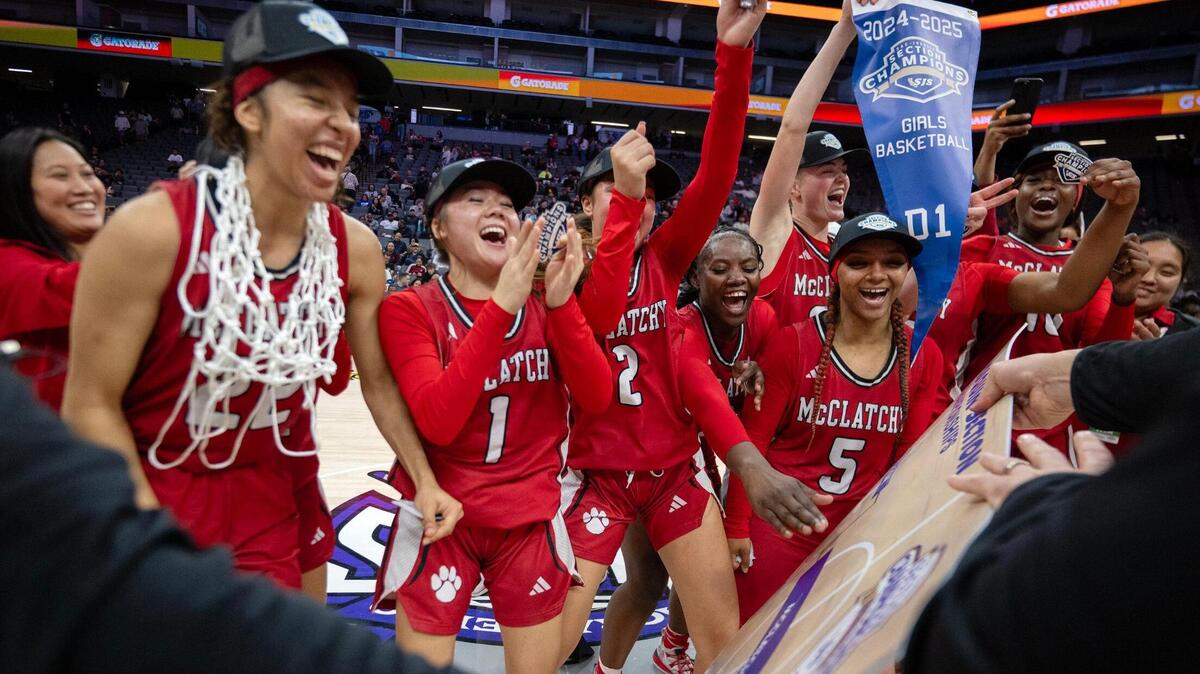 The McClatchy Lions celebrate after defeating Folsom in the Sac-Joaquin Section Division I girls basketball championship on Friday.
