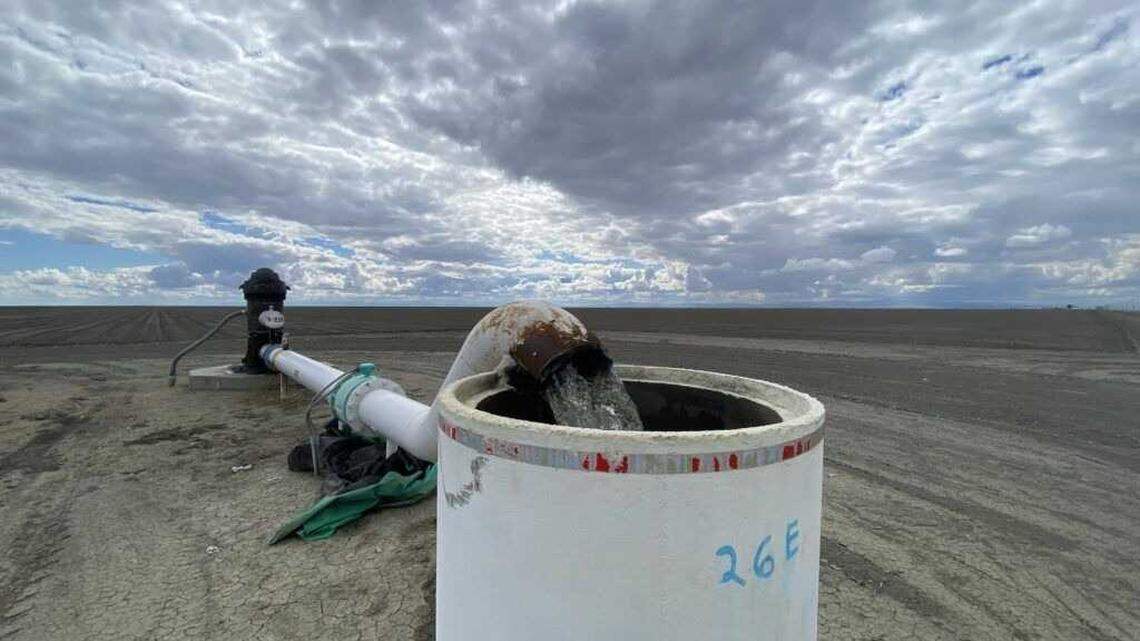 A well on land owned by the J.G. Boswell Co. in the Tulare Lake subbasin gushes groundwater into a standpipe in this 2021 photo. On Tuesday, the state’s water board put the groundwater basin on probation for overdrafting.