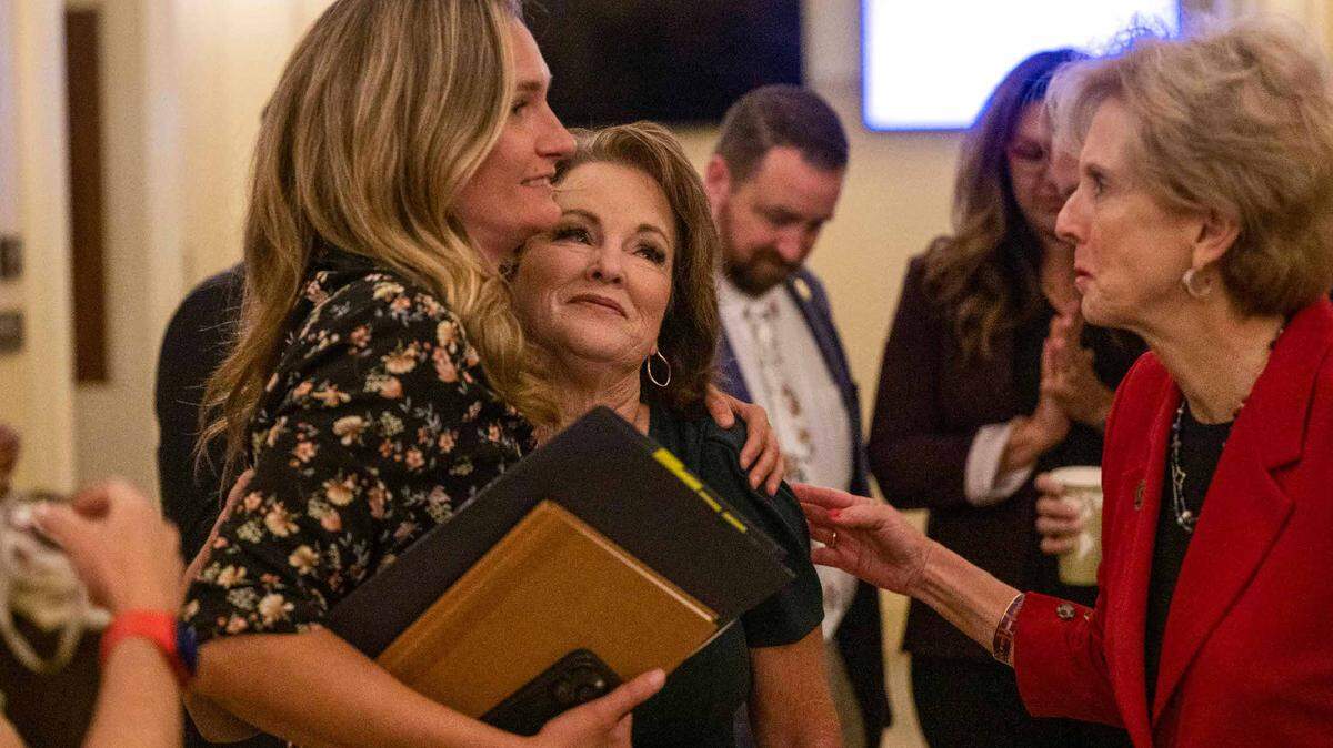 Sen. Shannon Grove, R-Bakersfield, center, is congratulated by staff member Lindsey Dietz, left, and Assemblymember Diane Dixon after her bill to strengthen penalties for child sex traffickers was revived in an emergency Assembly Public Safety Committee hearing in July. On Friday, Grove’s bill made it out of the Assembly Appropriations Committee and onto the Assembly floor.