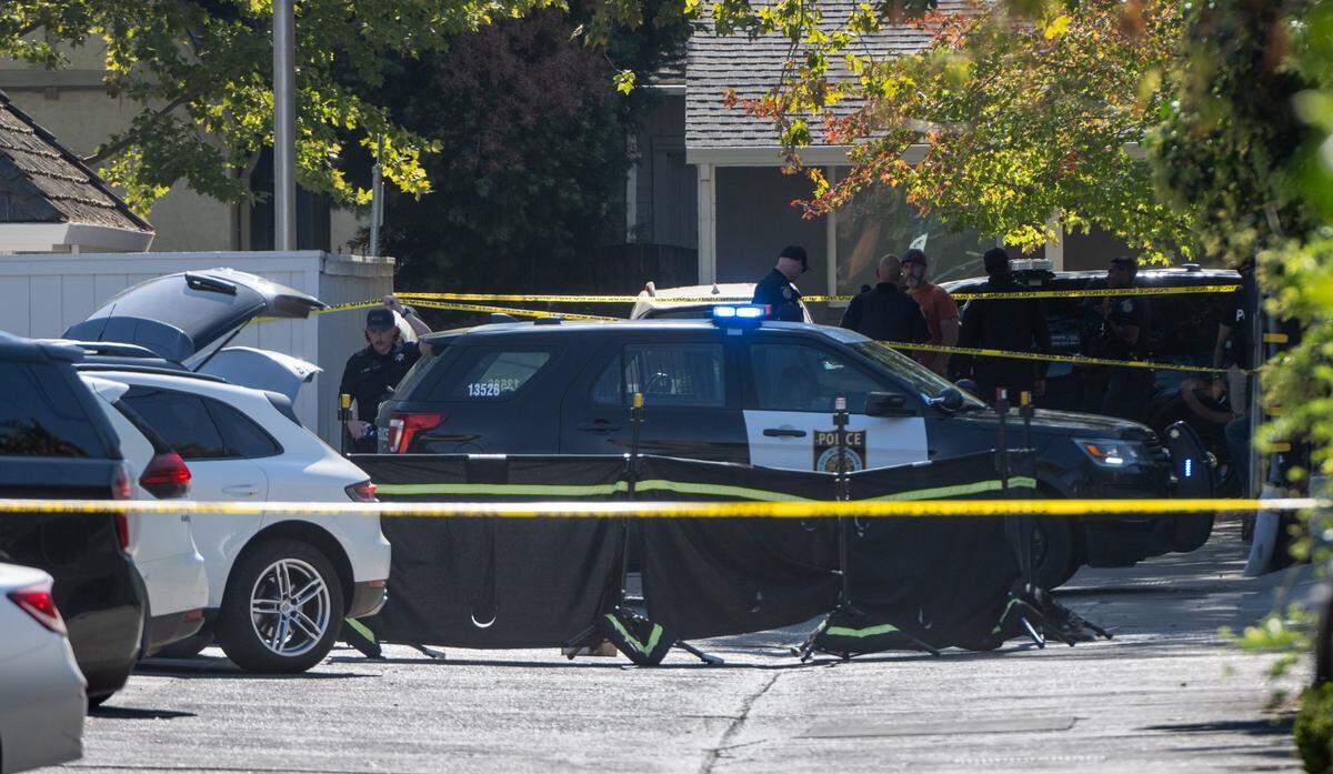 Crime scene tape and screens surround an area under investigation by Sacramento Police officers after a shooting at 39th and N streets near the Sutter Lawn Tennis Club in Sacramento on Thursday, Oct. 20, 2022.