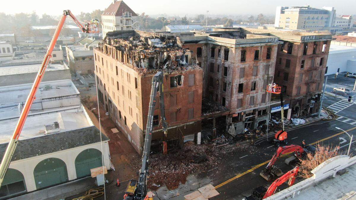 Workers demolish the Hotel Marysville in the city’s downtown on Wednesday, Dec. 11, 2024.