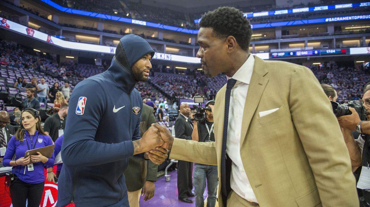 FILE -- New Orleans Pelicans forward DeMarcus Cousins (0) shakes hands with former Sacramento Kings player Chris Webber on Thursday, October 26, 2017 at Golden 1 Center in Sacramento.