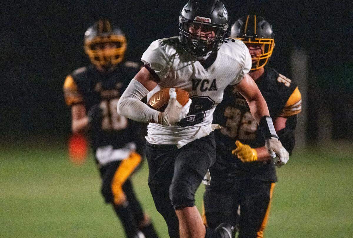 The Valley Christian Lions’ Riley Garcia (3) races for a touchdown Friday after catching a long pass during the second half.