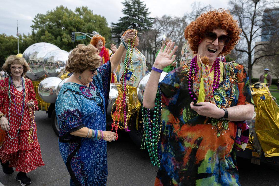 The Sacramento Roper Romps, a group of costumed pub crawlers inspired by Helen Roper from "Three's Company,” march on Capitol Mall during the City of Trees Parade on Saturday, Feb. 28, 2026.