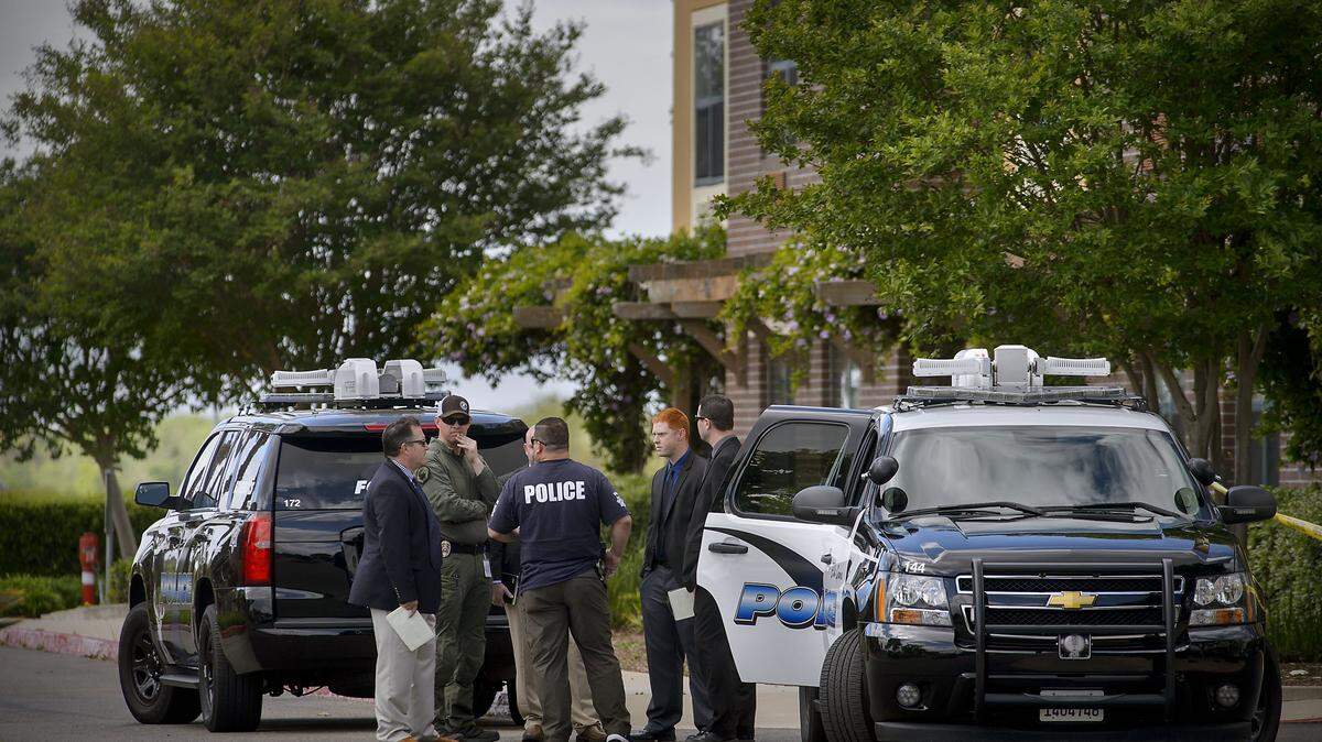 Police investigators process evidence at the Extended Stay America hotel in Elk Grove, where a fatal officer-involved shooting took place early Saturday. The Sacramento County Coroner’s Office later identified the man killed as Nolberto Hernandez Leon, 26, of Sacramento.
