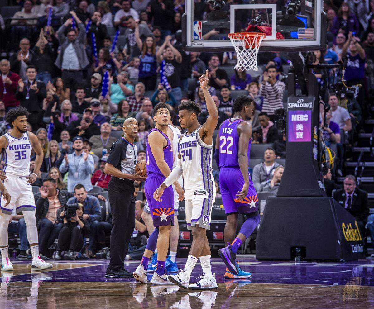Sacramento Kings guard Buddy Hield (24) is celebrated after hit hit a 3-pointer to break the single season record by Peja Stojaovic in the 2003-04 season against the Phoenix Suns on Saturday, March 23, 2019 during their game at the Golden 1 Center in Sacramento, Calif.