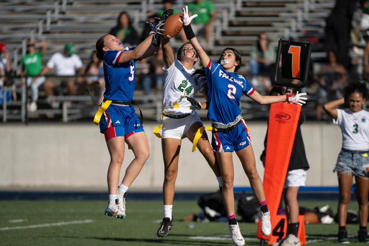 The Christian Brothers Falcons’ Aleyah Harmon (5) and Rosemary Emseih (2) block a pass to the St. Mary’s Rams’ Leilana Olanolan (24) in the second half of the CIF Sac-Joaquin Division II flag football championship on Saturday, Nov. 4, 2023, at Cosumnes River College in Sacramento.