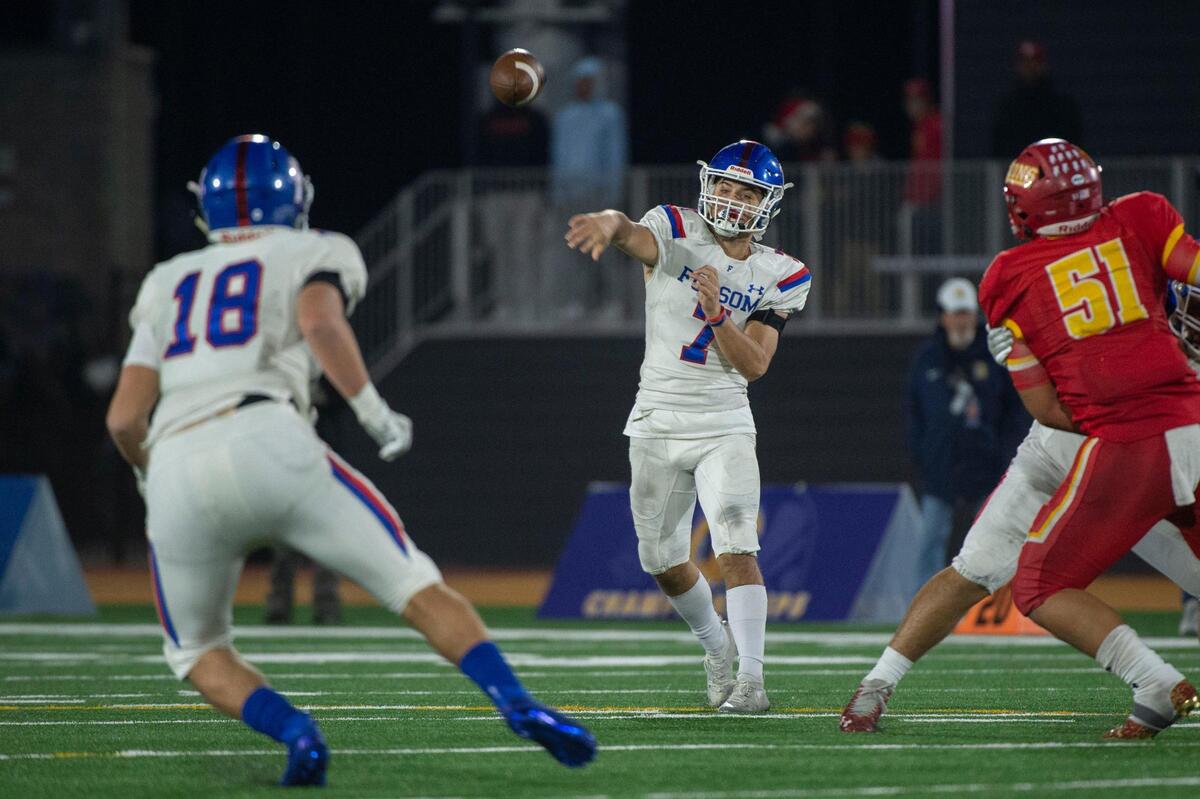 Folsom High School Tyler Tremain (7) makes a pass to Mason Norberg (18) against Cathedral Catholic during the CIF State Division I-AA Championship Saddleback College in Mission Viejo on Friday, Dec. 10, 2021.
