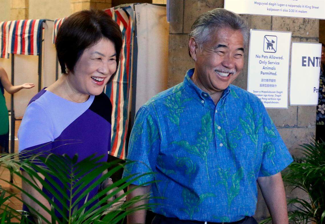 In this Wednesday, Aug. 8, 2018 photo, Hawaii Gov. David Ige, right, and first lady Dawn Amano Ige smile after voting early in the state’s primary election in Honolulu.