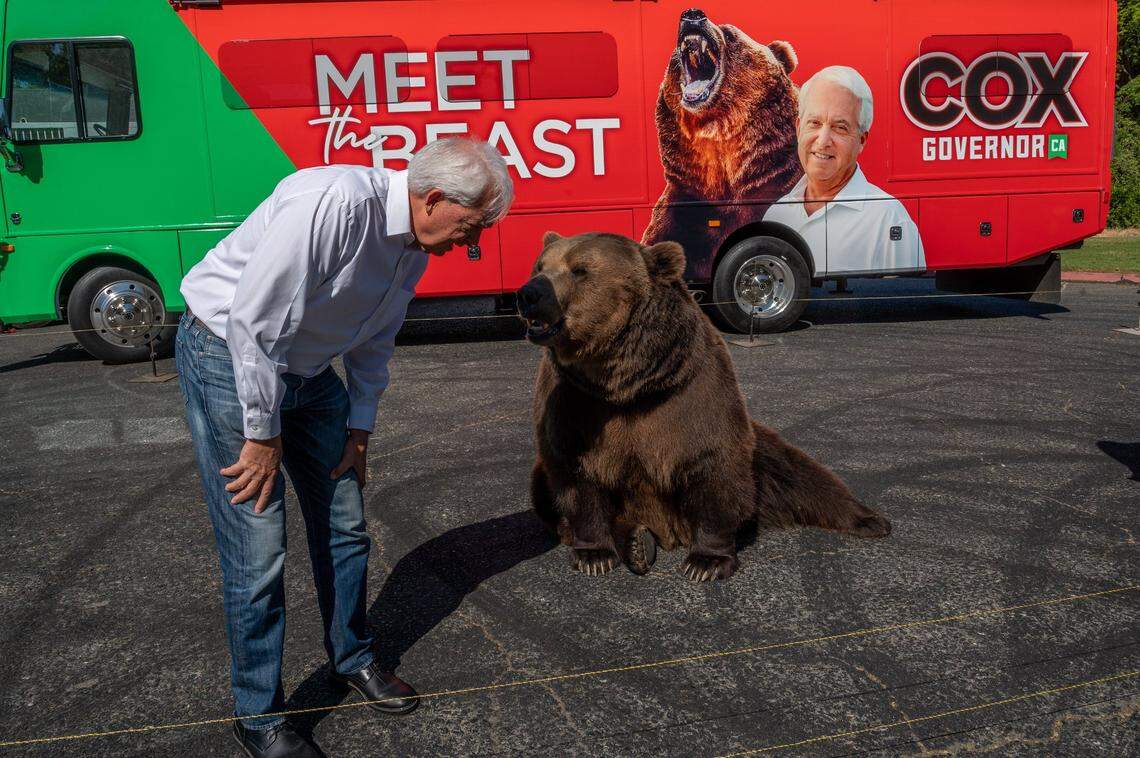 John Cox, Republican recall candidate for California governor, begins his statewide “Meet the Beast” bus tour on Tuesday, May 4, 2021 with Tag, a Kodiak brown bear, at Miller Regional Park in Sacramento.