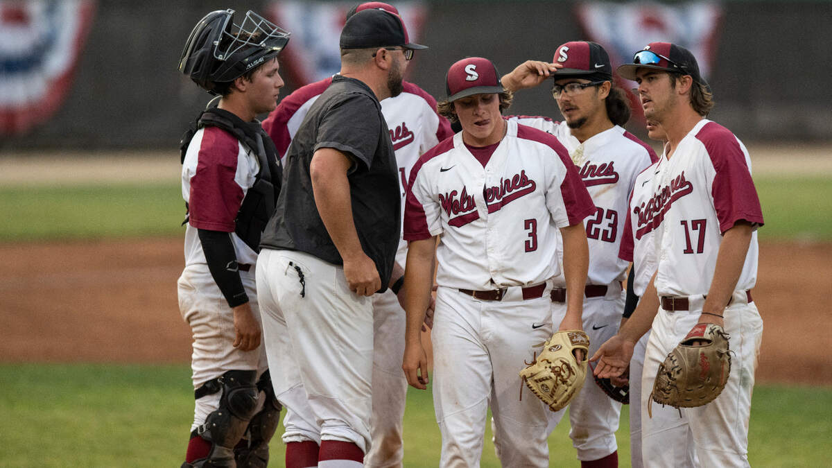 Sierra coach Ryan Evangelho visits the mound to remove starting pitcher Jaren Ekkelboom (3) in the fourth inning against Saddleback on Sunday, May 28, 2023, in the California community college state championship tournament at Folsom Lake College.