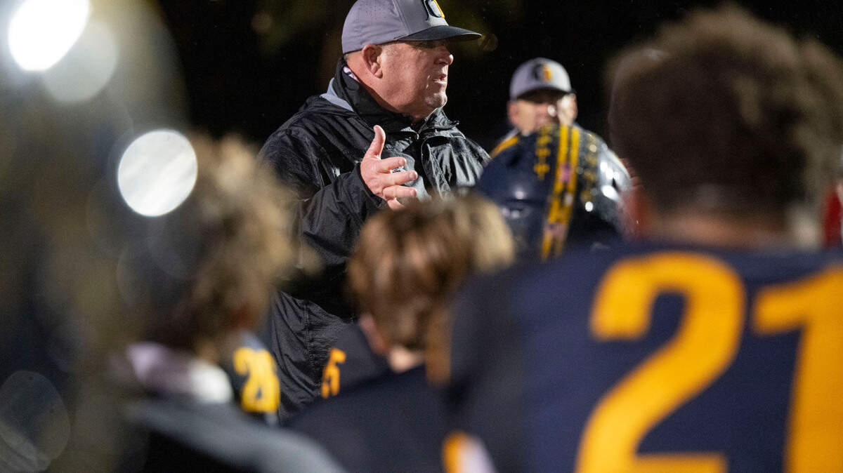 Oak Ridge Trojans coach Casey Taylor congratulates his team after they defeated the Turlock Bulldogs in a Sac-Joaquin Section semifinal playoff game on Friday in El Dorado Hills. Oak Ridge faces Folsom on Saturday in section finals at Sacramento City College’s Hughes Stadium.