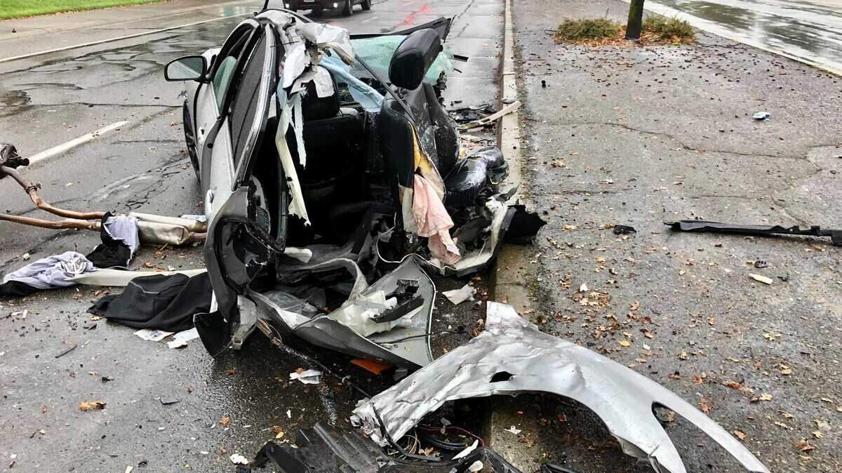 A gray Infiniti coupe struck a tree and was torn in half before hitting a Subaru in the oncoming lane Tuesday Nov. 9, 2021, on Madison Avenue in Orangevale, California.