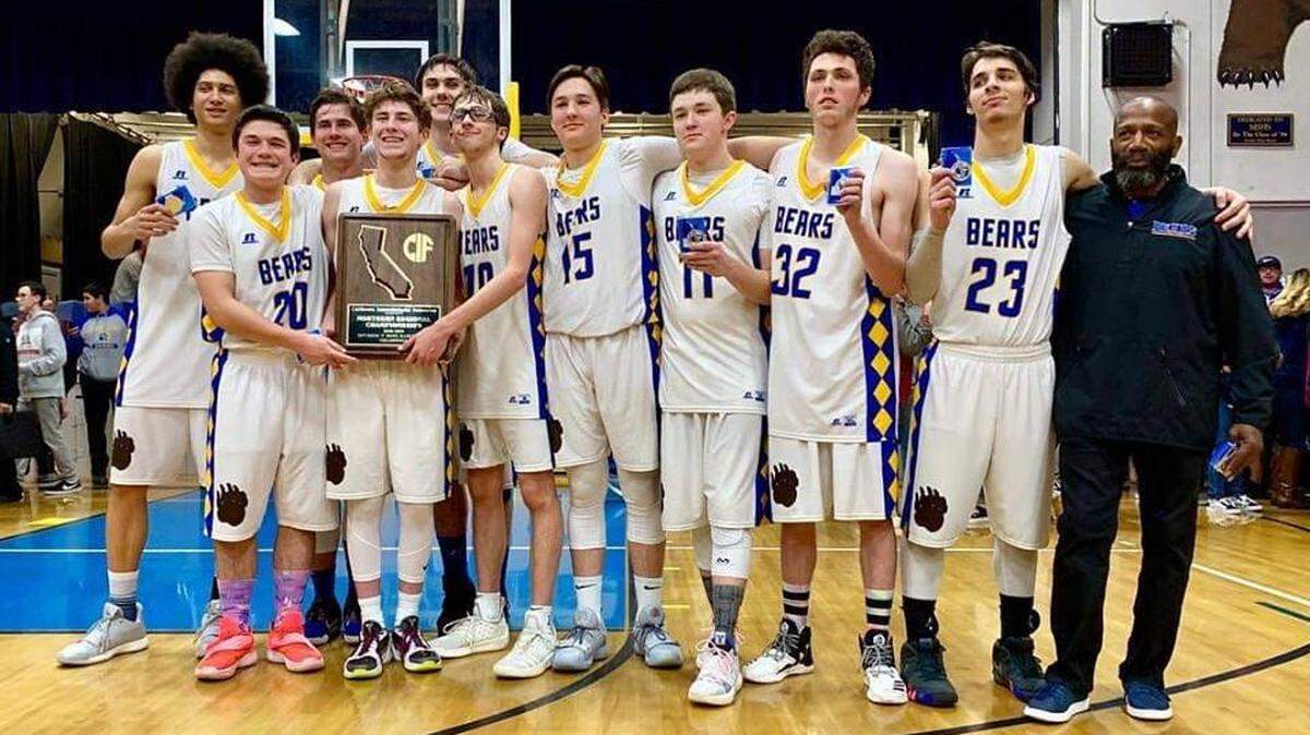 The Mt. Shasta High School boys basketball team poses with its CIF NorCal Division V championship plaque after defeating Dinuba on Tuesday night. Mt. Shasta will play Foothill of Bakersfield for the CIF State title Friday at noon at Golden 1 Center. MOUNT SHASTA AREA NEWSPAPERS