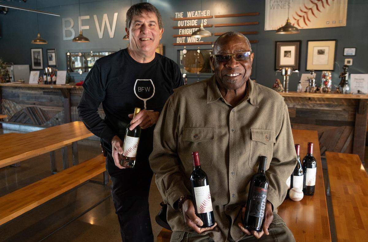 Local baseball great Dusty Baker, the manager for the Houston Astros – and former manager of the San Francisco Giants – who started his baseball career at Del Campo High School, sits with winemaker Chil Brenneman inside of the tasting room at the Baker Wine Family in West Sacramento in December.