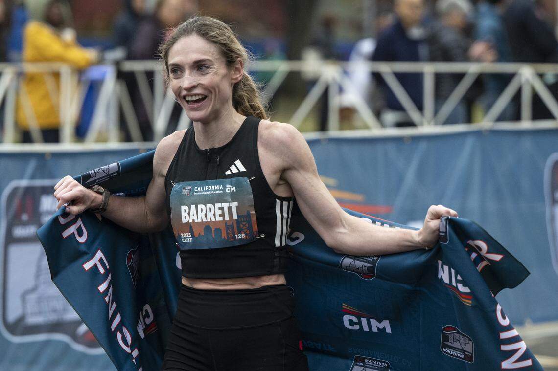 Tessa Barrett reacts after she crosses the finish line of the California International Marathon in Sacramento on Sunday, Dec. 7, 2025.