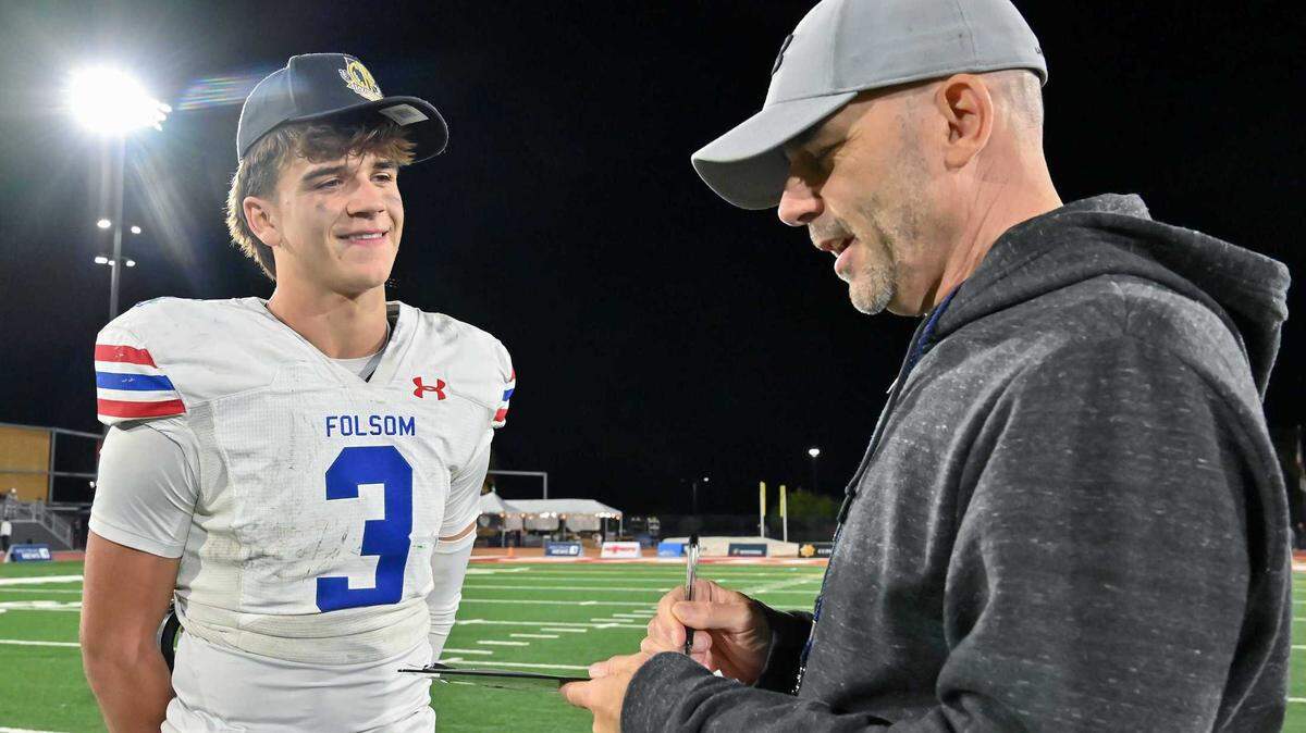 Sacramento Bee reporter Joe Davidson interviews Folsom High quarterback Ryder Lyons after the Bulldogs won the 2023 CIF Division 1-A state football championship at Saddleback College in Mission Viejo. Davidson, a stalwart of Sacramento sports journalism for more than three decades, will be enshrined in the California High School Football Hall of Fame.