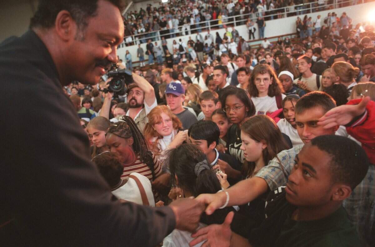 Rev. Jesse Jackson shakes hands on Sept. 17, 1997, with the students from Sacramento High School who pledged to him to stay off drugs and become better students. Jackson also asked the student body to join him in his march against Proposition 209 to Sacramento.