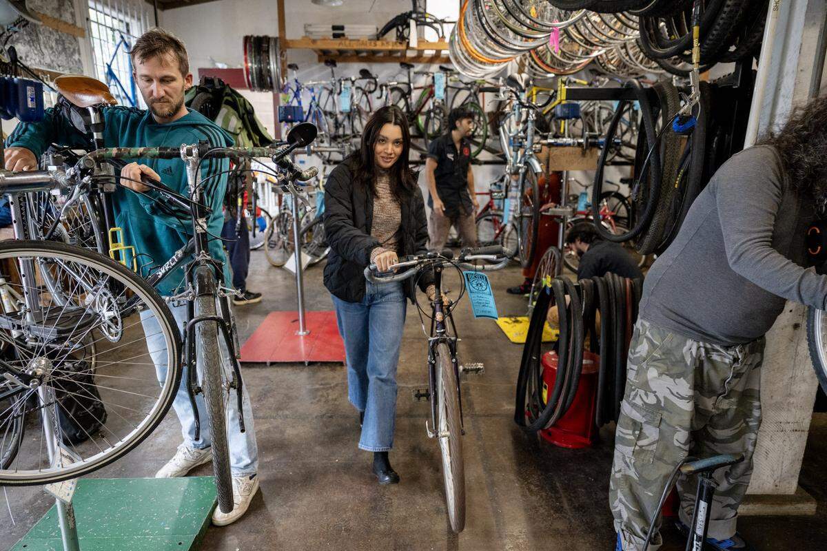 Ezzie Padilla takes a bike out for a test ride at the Sacramento Bicycle Kitchen on Tuesday, May 5, 2026.