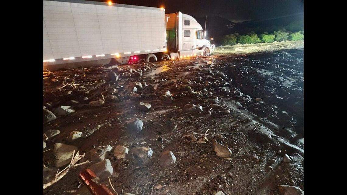 Drivers had to be rescued from vehicles stuck on Highway 126 near Fillmore after mud and flood waters inundated the roadway in California.