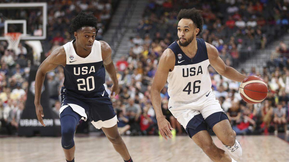 Team White guard Derrick White (46) dribbles the ball past Team Blue guard De’Aaron Fox (20) during the first half of the U.S. men’s basketball team’s scrimmage in Las Vegas, Friday, Aug. 9, 2019. (Erik Verduzco/Las Vegas Review-Journal via AP)