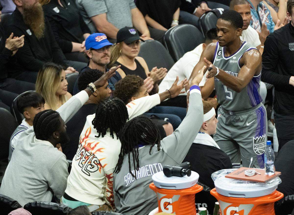 Sacramento Kings guard De’Aaron Fox (5) high -fives fans during a time out during Game 5 of the first-round NBA playoff series at Golden 1 Center on Wednesday.