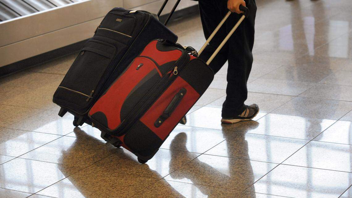A passenger retrieves luggage after arriving at Hartsfield Jackson Atlanta International Airport in Atlanta in 2010. On Tuesday, an airport in Berlin, Germany, was partly shut down after security scanners detected a suspicious object in a passenger’s luggage, officials said. The item turned out to be a vibrator.