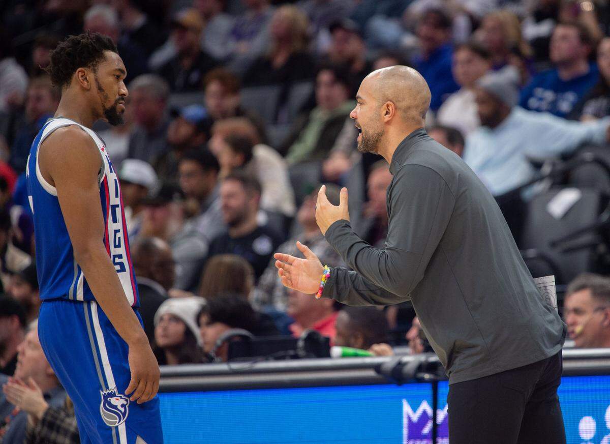 Sacramento Kings guard Malik Monk (0) talks with associate head coach Jordi Fernandez during an NBA game between the Sacramento Kings and the Atlanta Hawks on Monday, Jan. 22, 2024, at Golden 1 Center.