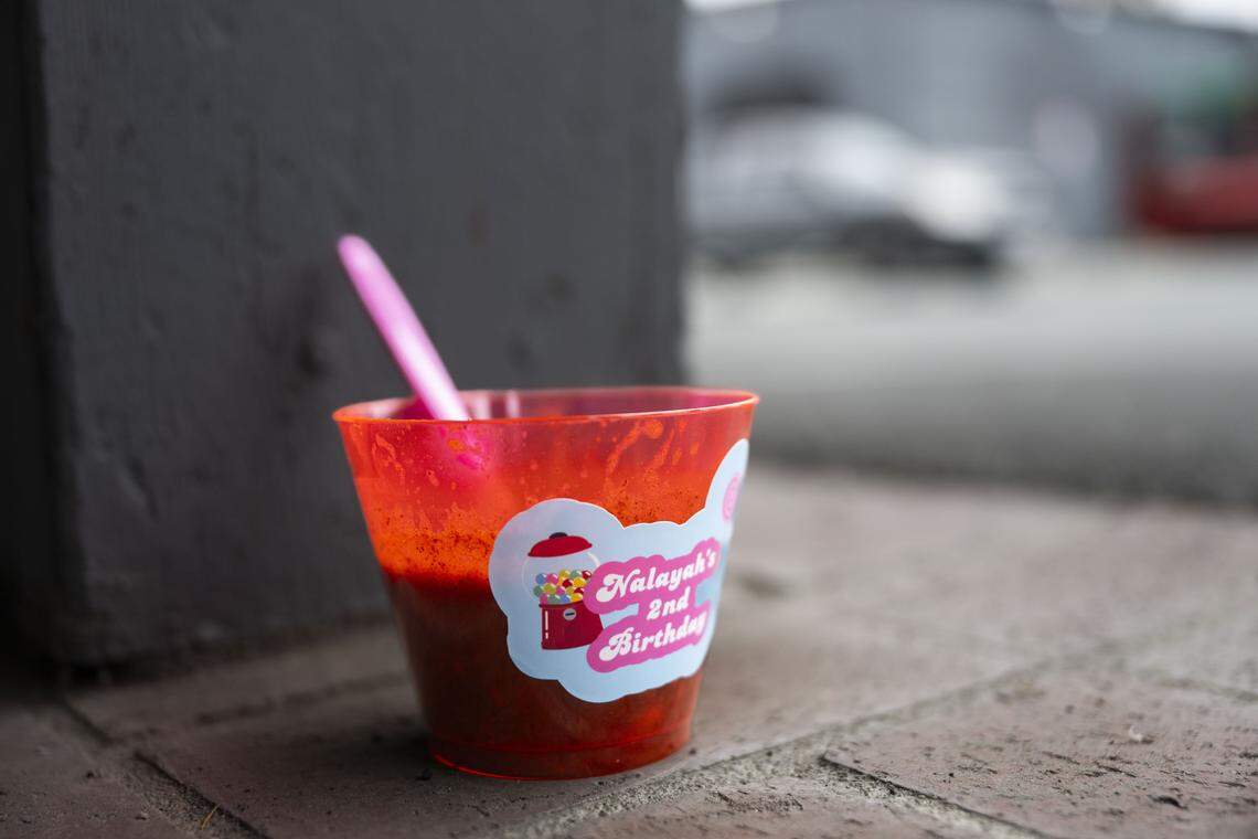 A cup labelled “Nalayah’s 2nd Birthday” sits on Monday at the Lucile Avenue building just outside the Stockton city limits where 15 people were hit by gunfire in a mass shooting over the weekend.