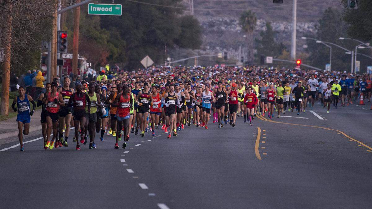 Runners start the California International Marathon on Dec. 4, 2016, in Folsom. Runner Frank Meza was banned from the race after he was disqualified in 2014 and 2016. Meza, 70, was found dead at the Los Angeles River on Thursday.